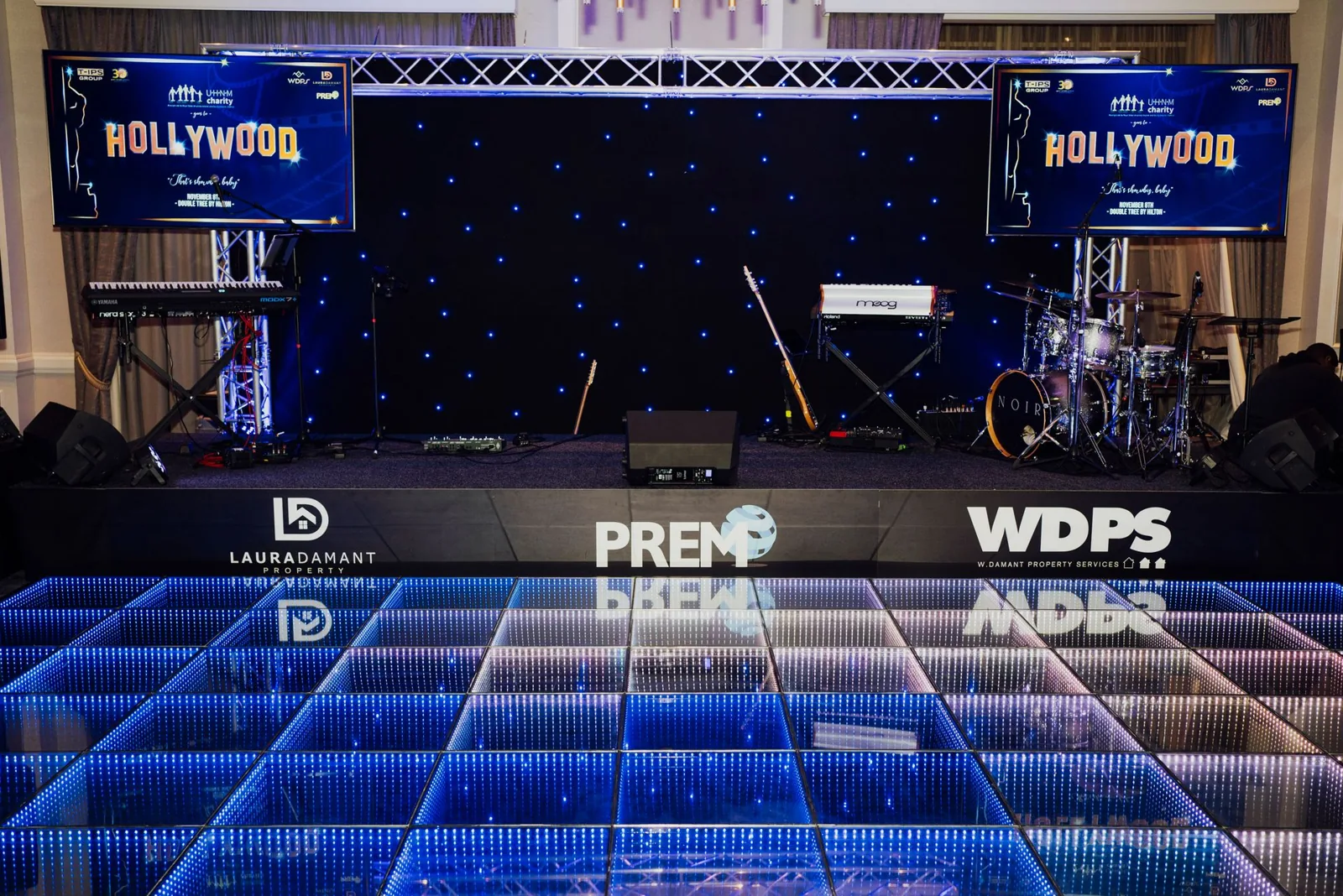 PREM stage and blue illuminated dance floor at the UHNM Hollywood charity ball