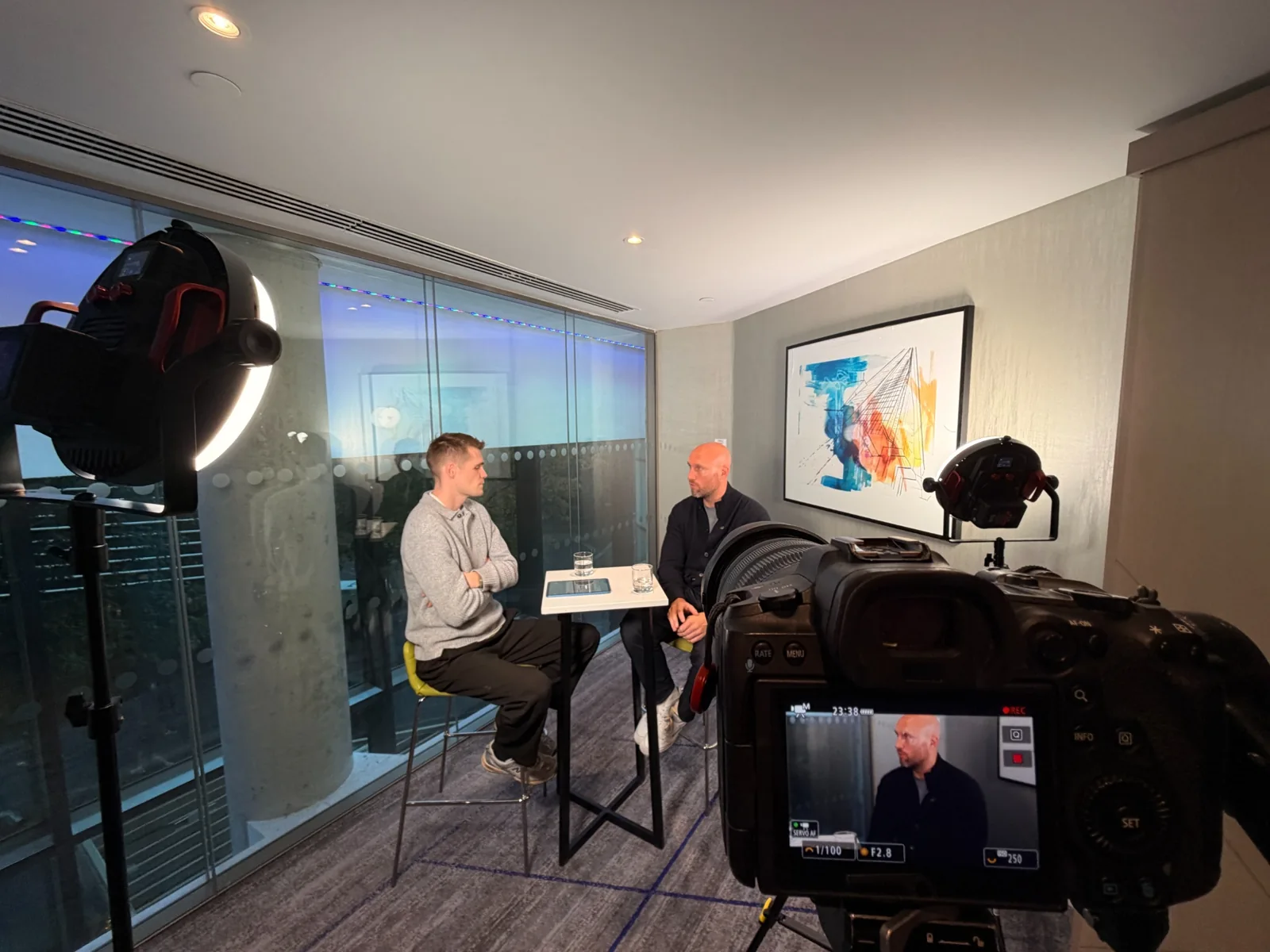 Professional camera and lighting equipment recording an interview
